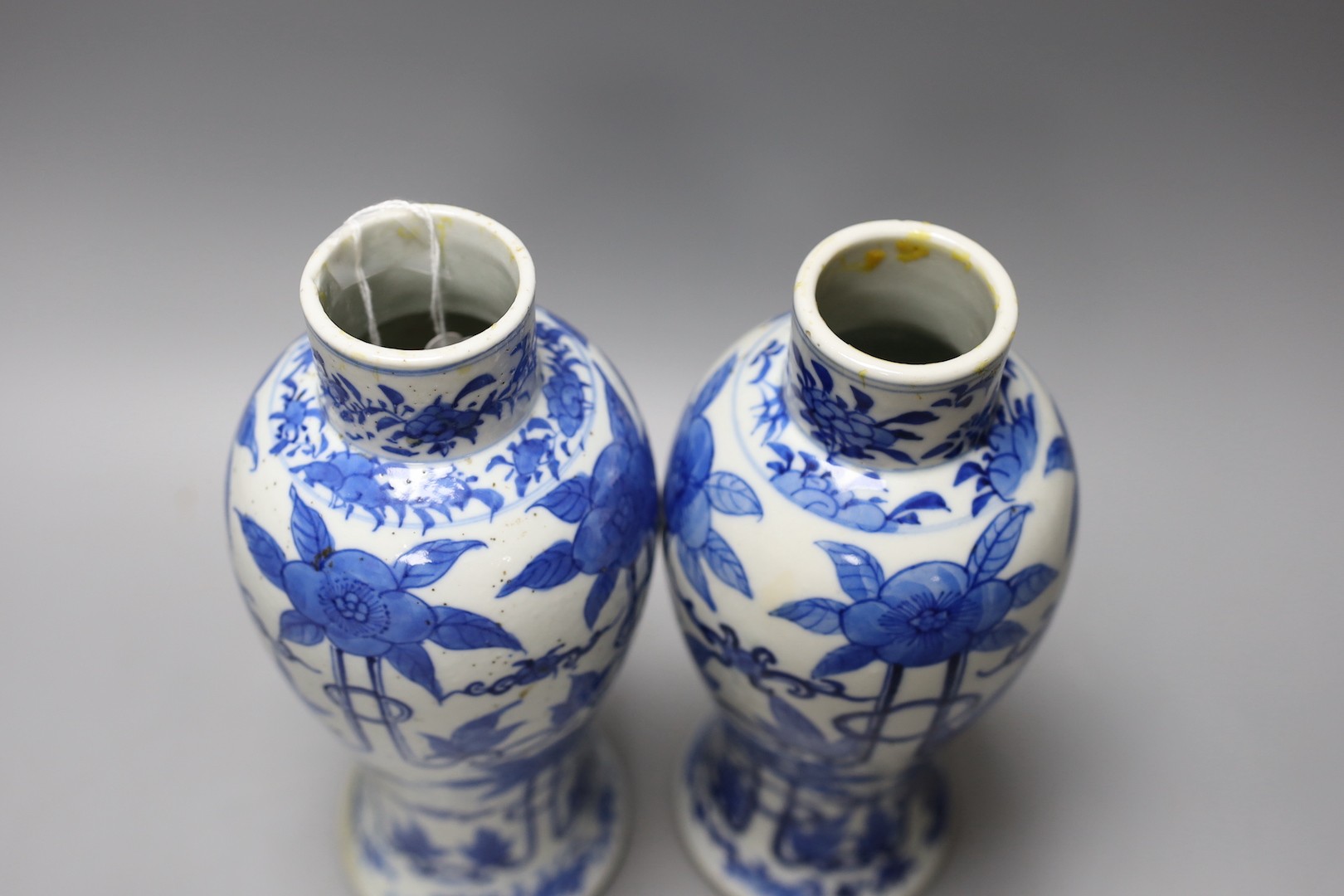 A pair of 19th century Chinese blue and white baluster jars and covers, 27cm